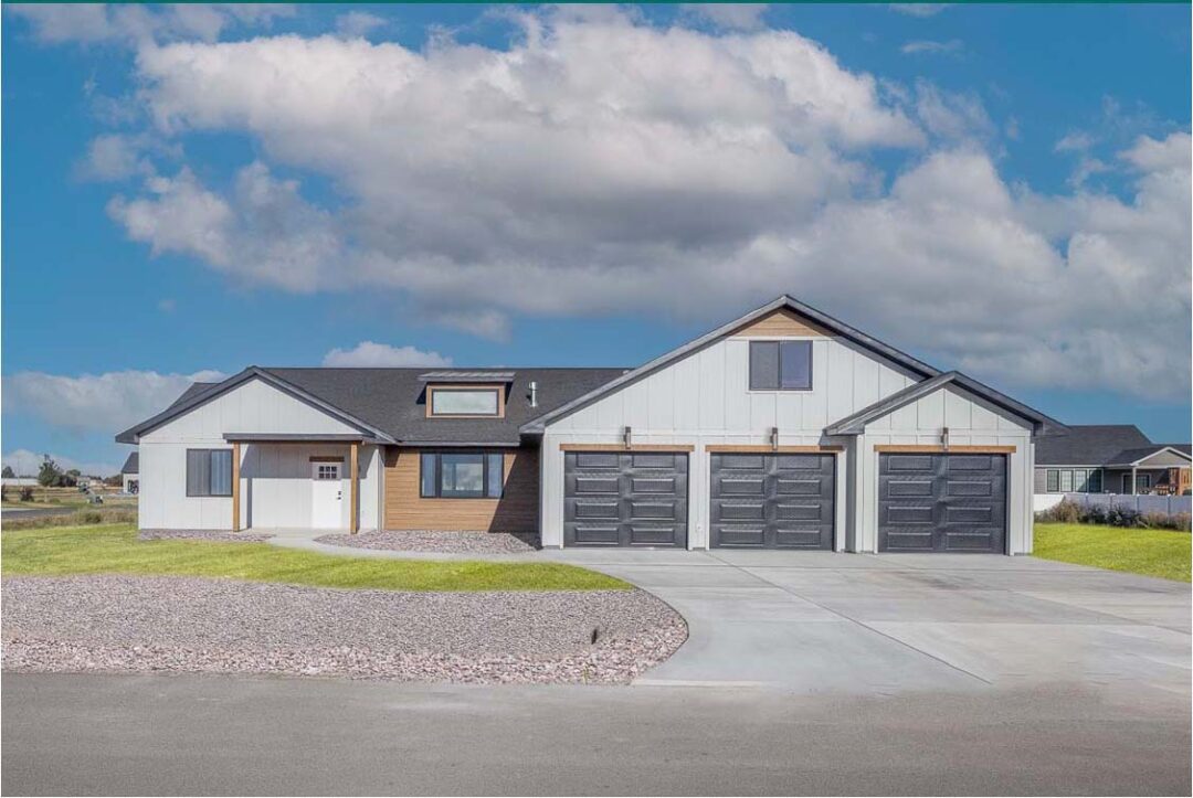 Modern new home with a spacious garage in Billings, Montana, showcasing quality construction and des.