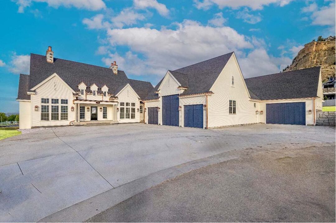 Modern home with attached garage and scenic mountain backdrop in Billings, Montana.